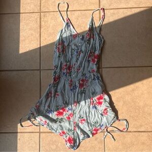 Light blue kids romper with floral print